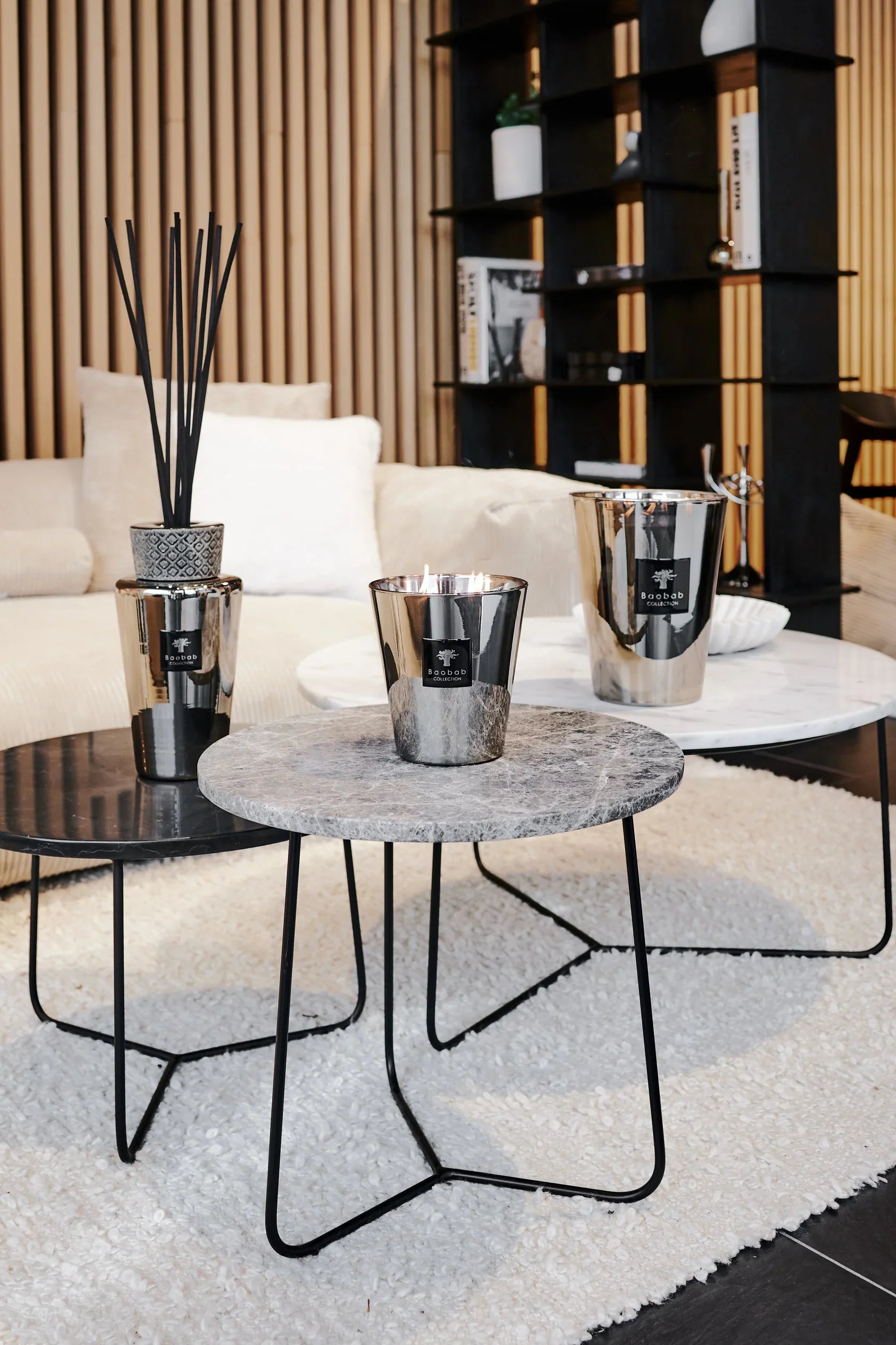 Stylish living room featuring Baobab Collection candles on elegant coffee tables with modern decor.