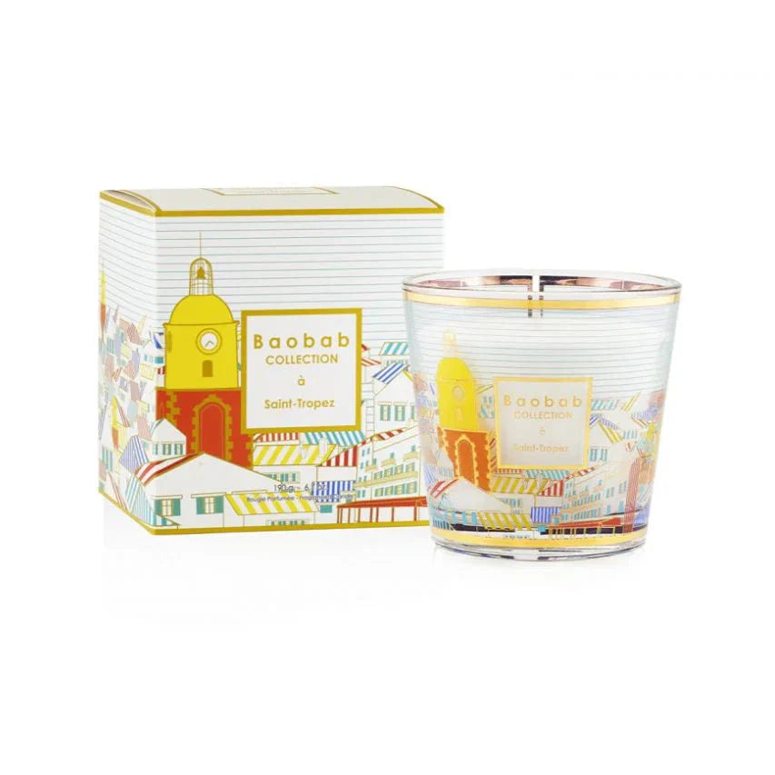 Baobab Collection Saint-Tropez scented candle with colorful packaging and a picturesque design featuring village rooftops.
