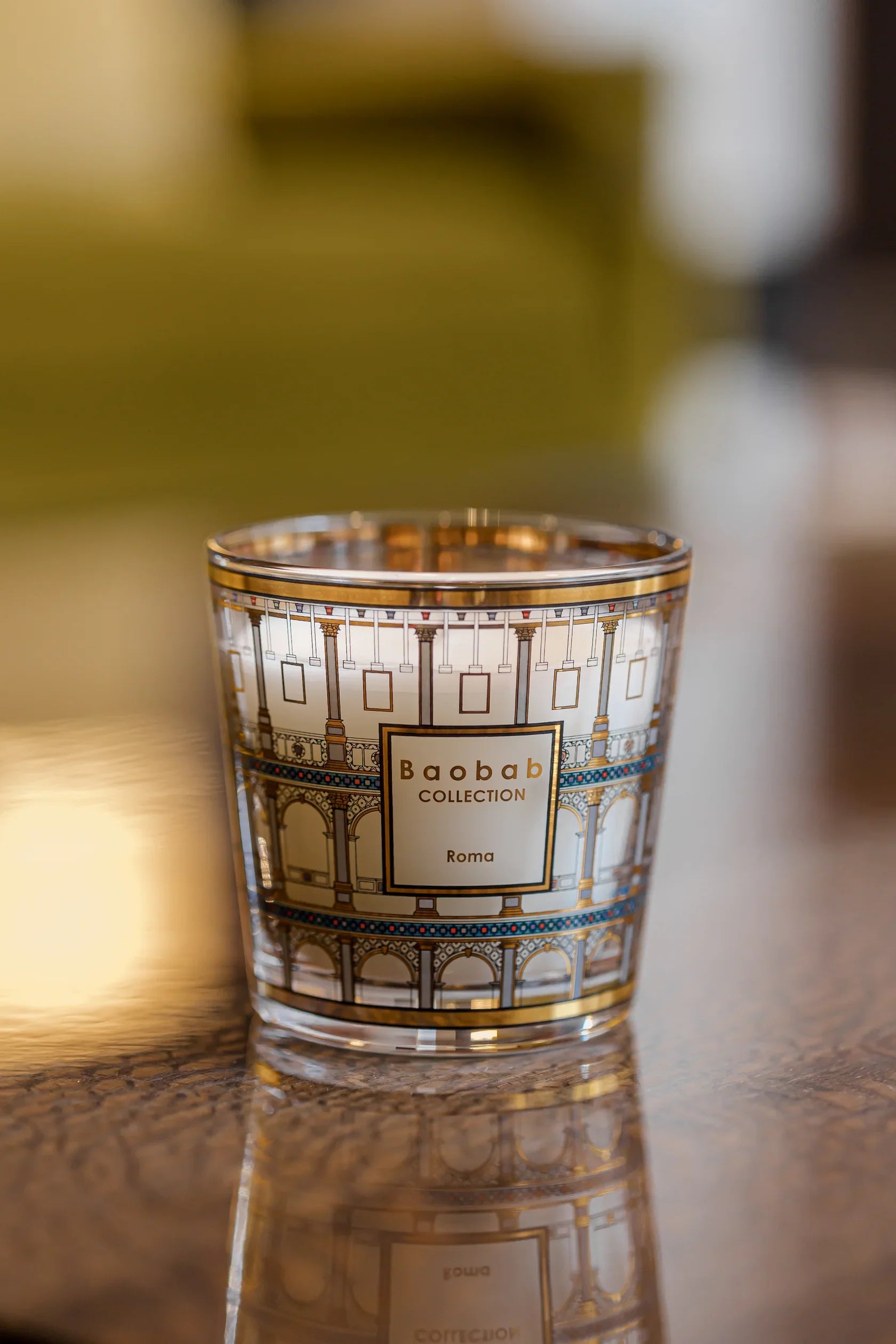 Baobab Collection Roma scented candle featuring gold and colored design inspired by the Colosseum.