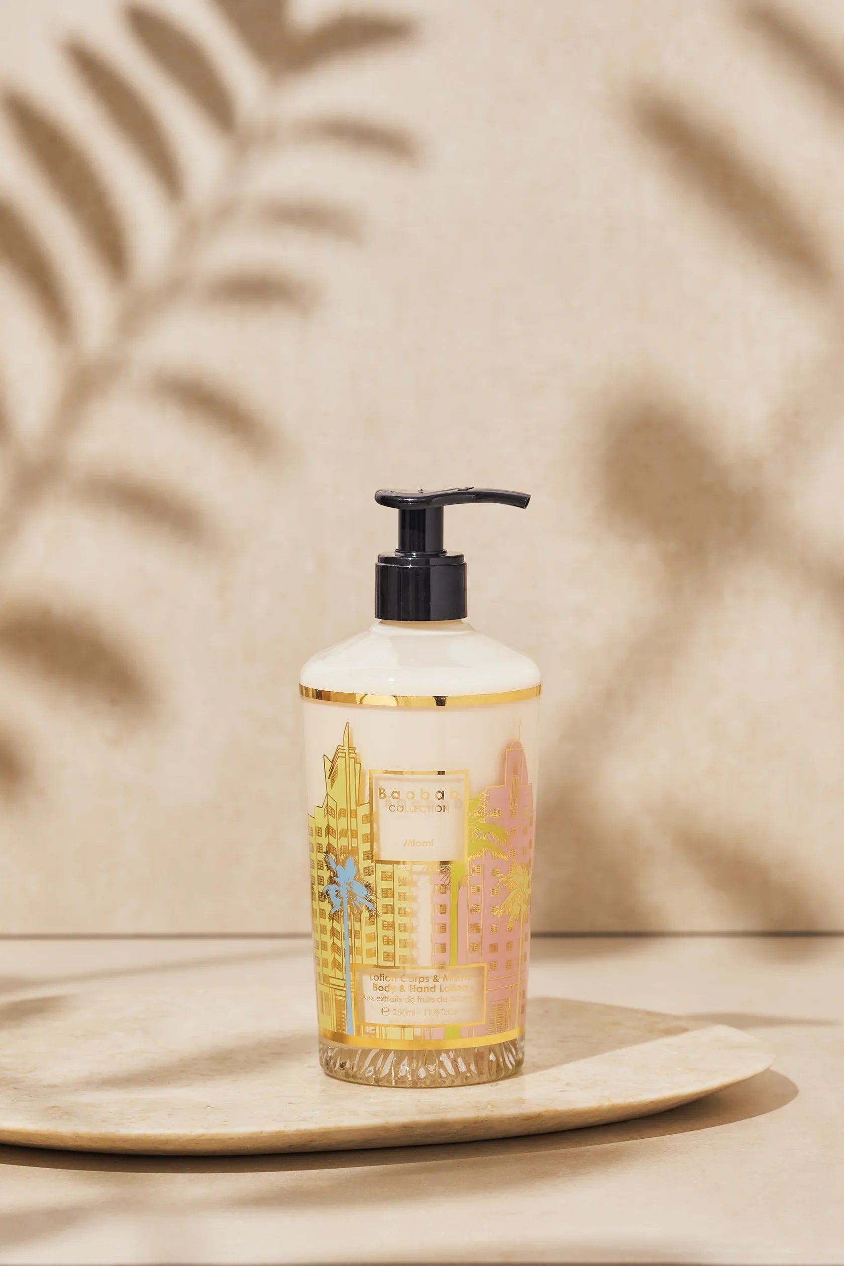 Baobab Collection Body & Hand Lotion 350ml Miami, elegantly packaged in a glass with pastel art deco design.