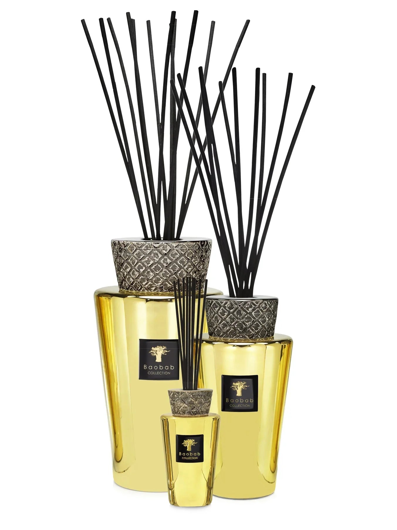 Baobab Collection TOTEM AURUM fragrance diffusers with black sticks and luxurious gold finish.