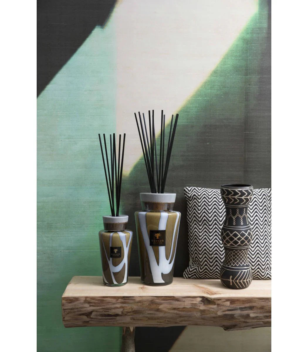 Baobab Collection diffuser Totem Stones Agate displayed on a wooden shelf with artistic backdrop.