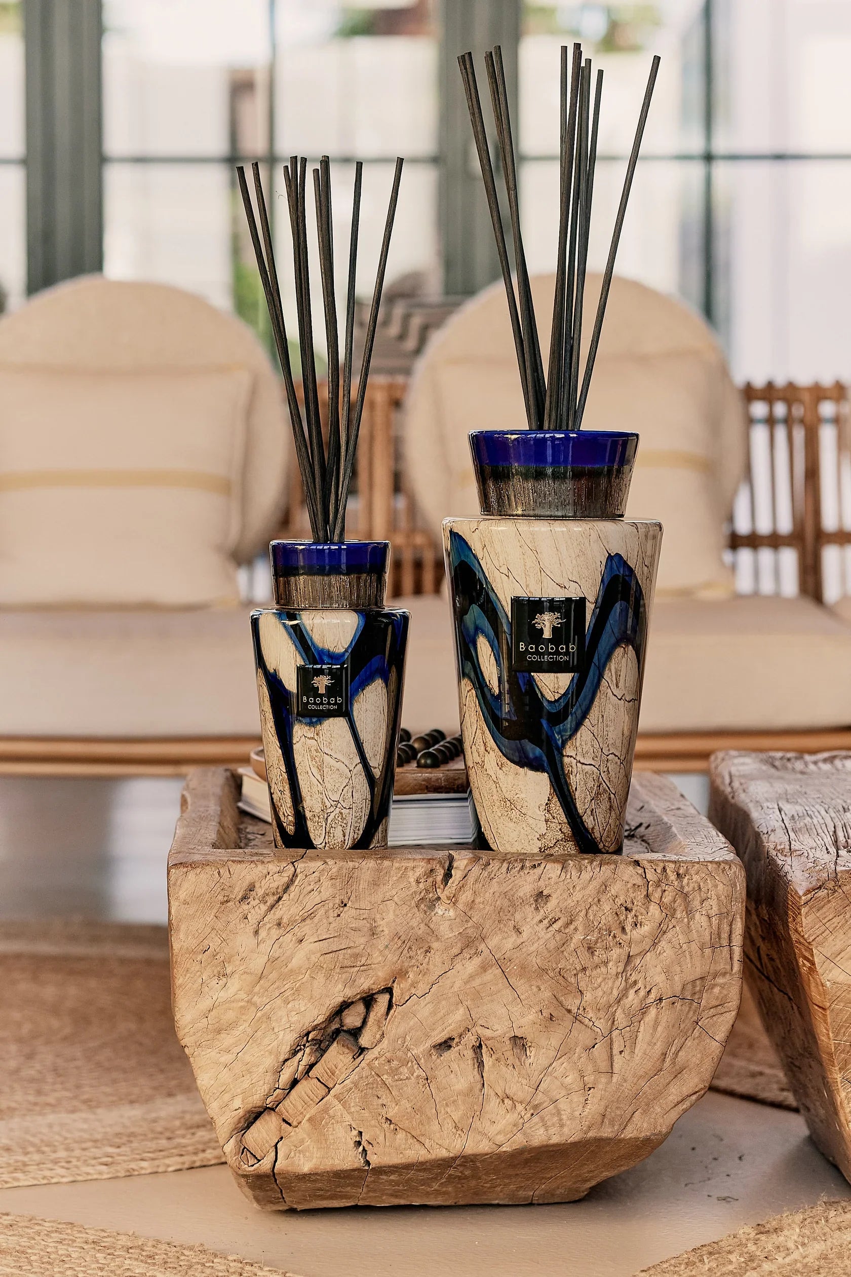 Baobab Collection TOTEM STONES LAZULI diffusers on a wooden table, featuring cobalt and gold accents.