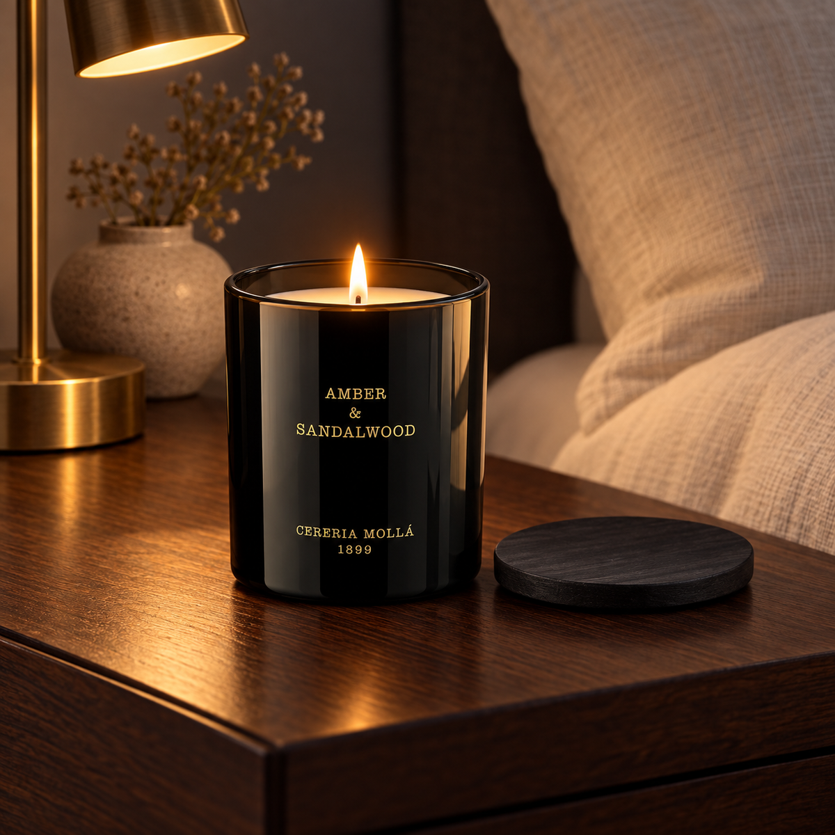 Cereria Molla Amber & Sandalwood 230 g candle in an elegant bedroom