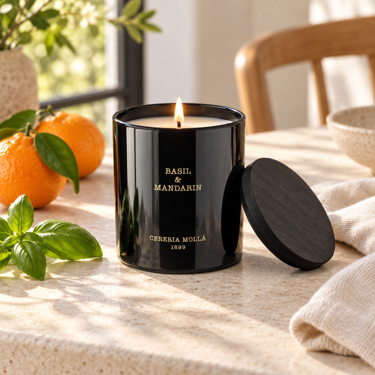 Cereria Molla Basil & Mandarin 230 g candle in a bright luxury interior