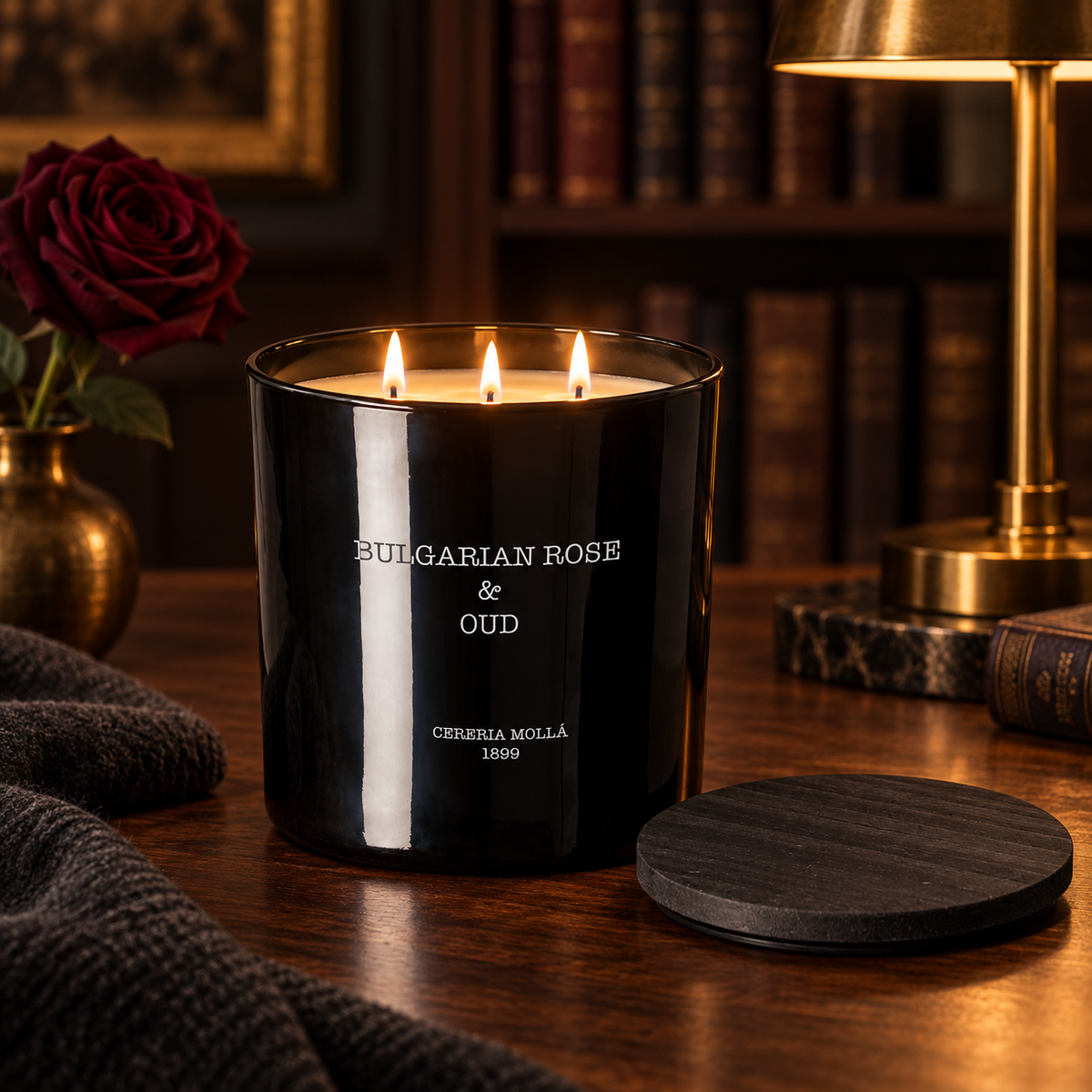 Cereria Molla Bulgarian Rose & Oud 3-wick XL candle in an elegant evening library