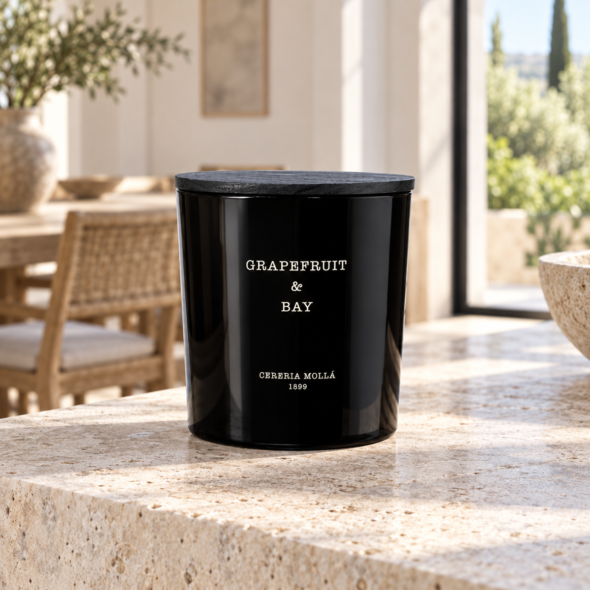 Cereria Molla Grapefruit & Bay XL candle in a sunlit Mediterranean interior