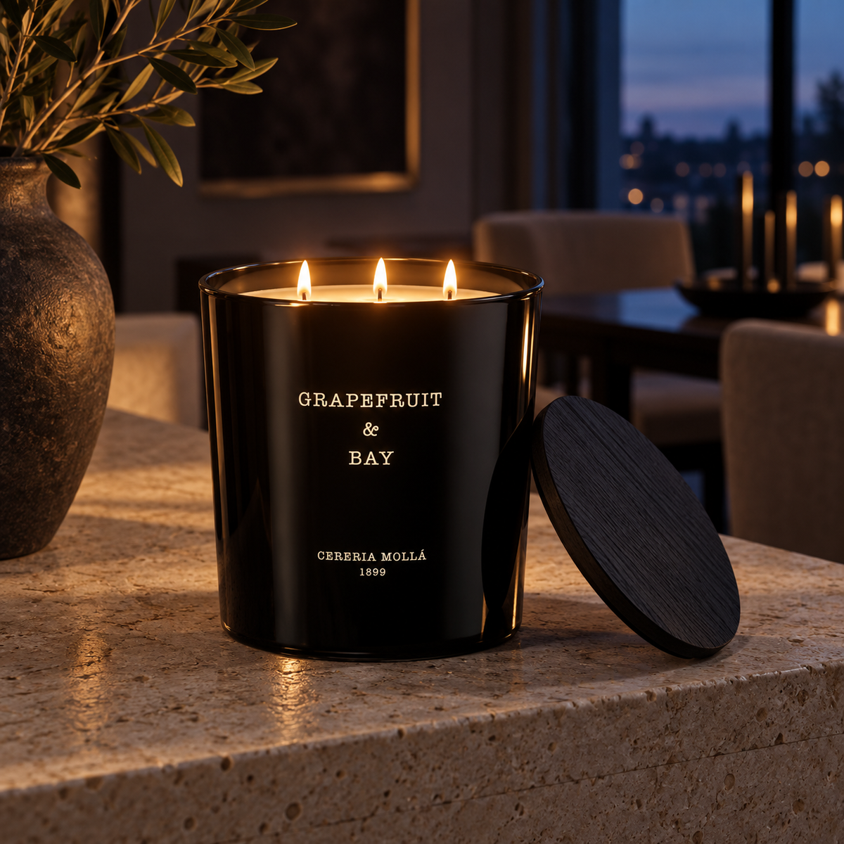 Cereria Molla Grapefruit & Bay XL three-wick candle in an elegant evening interior