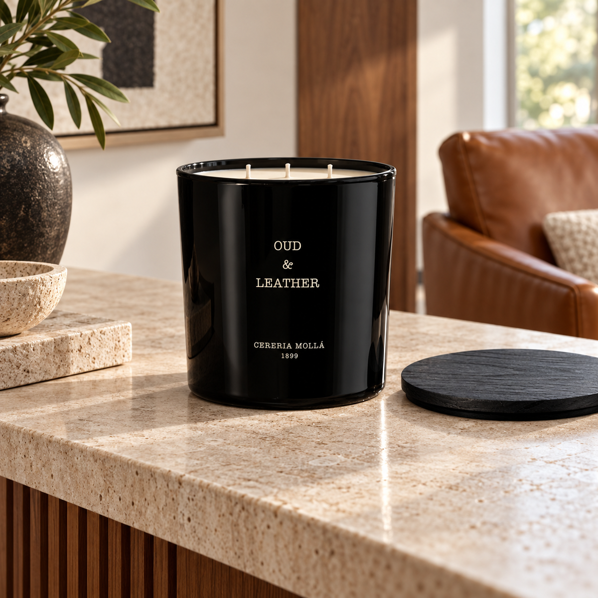 Cereria Molla Oud & Leather 600 g XL candle in a refined daylight study