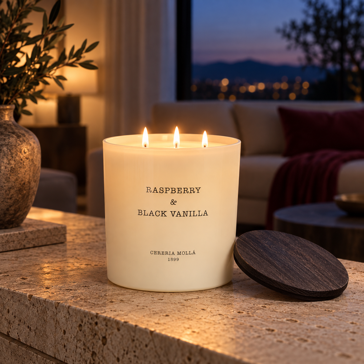 Cereria Molla Raspberry & Black Vanilla XL three-wick candle in an elegant evening interior