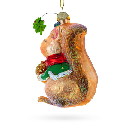 Squirrel Cradling an Acorn Glass Christmas Ornament