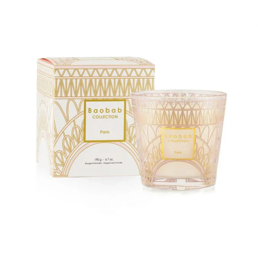 Baobab Collection scented candle 'Paris' in a powder pink glass with gold print packaging.