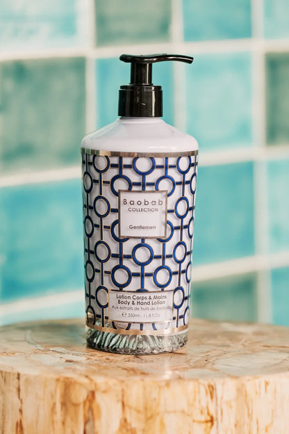 Baobab Collection Gentlemen body & hand lotion 350ml in a decorative navy blue bottle with geometric pattern.