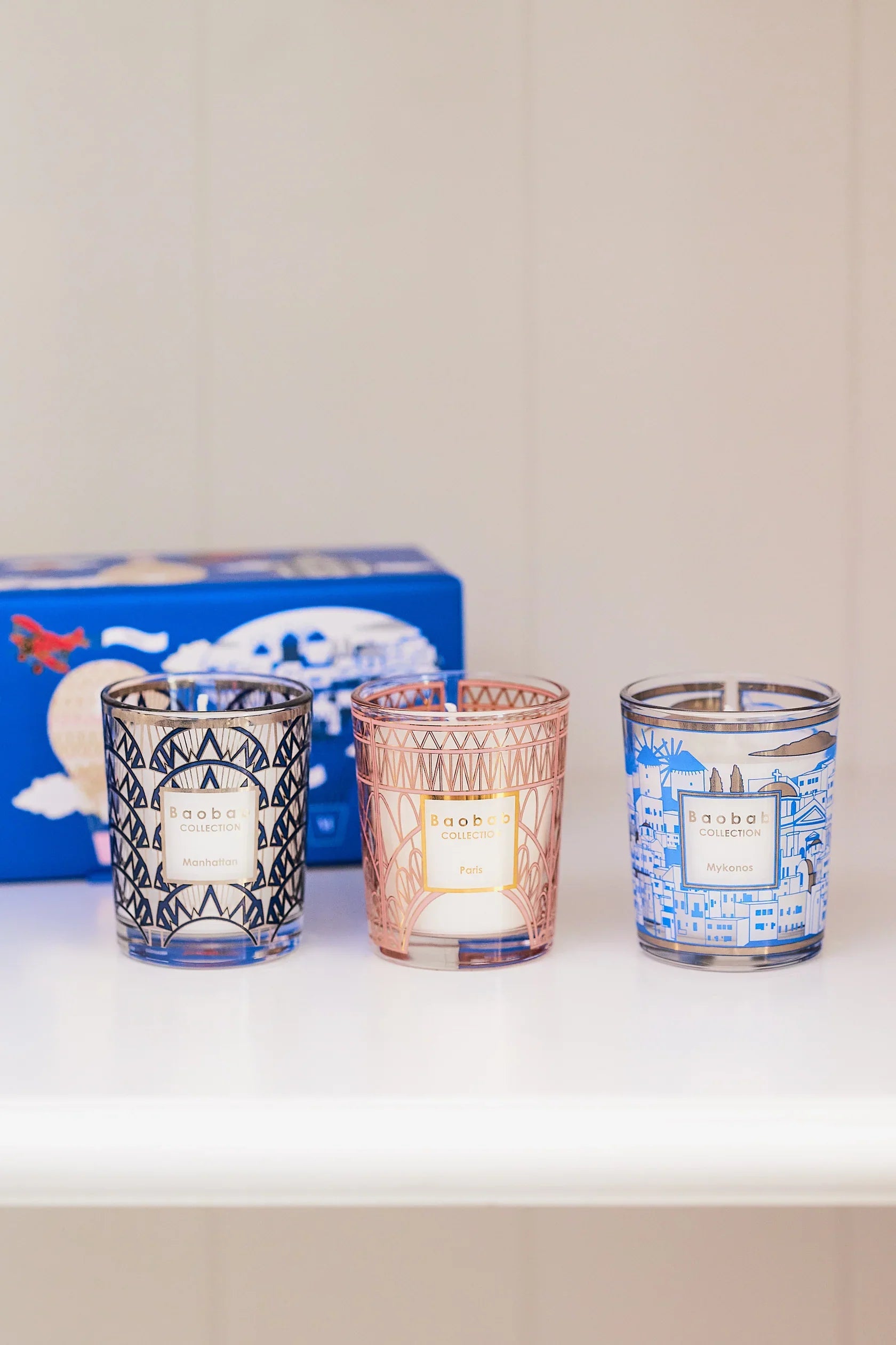 Baobab Collection Trio Candles in blue Mykonos box featuring Manhattan, Paris, and Mykonos scents.