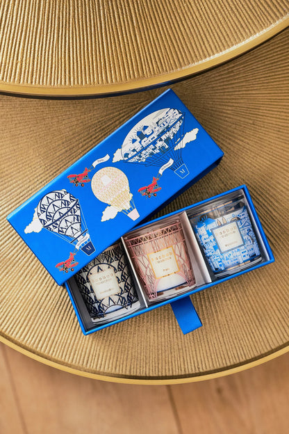Baobab Collection trio travel candles in a blue box featuring colors and designs from Manhattan, Paris, and Mykonos.