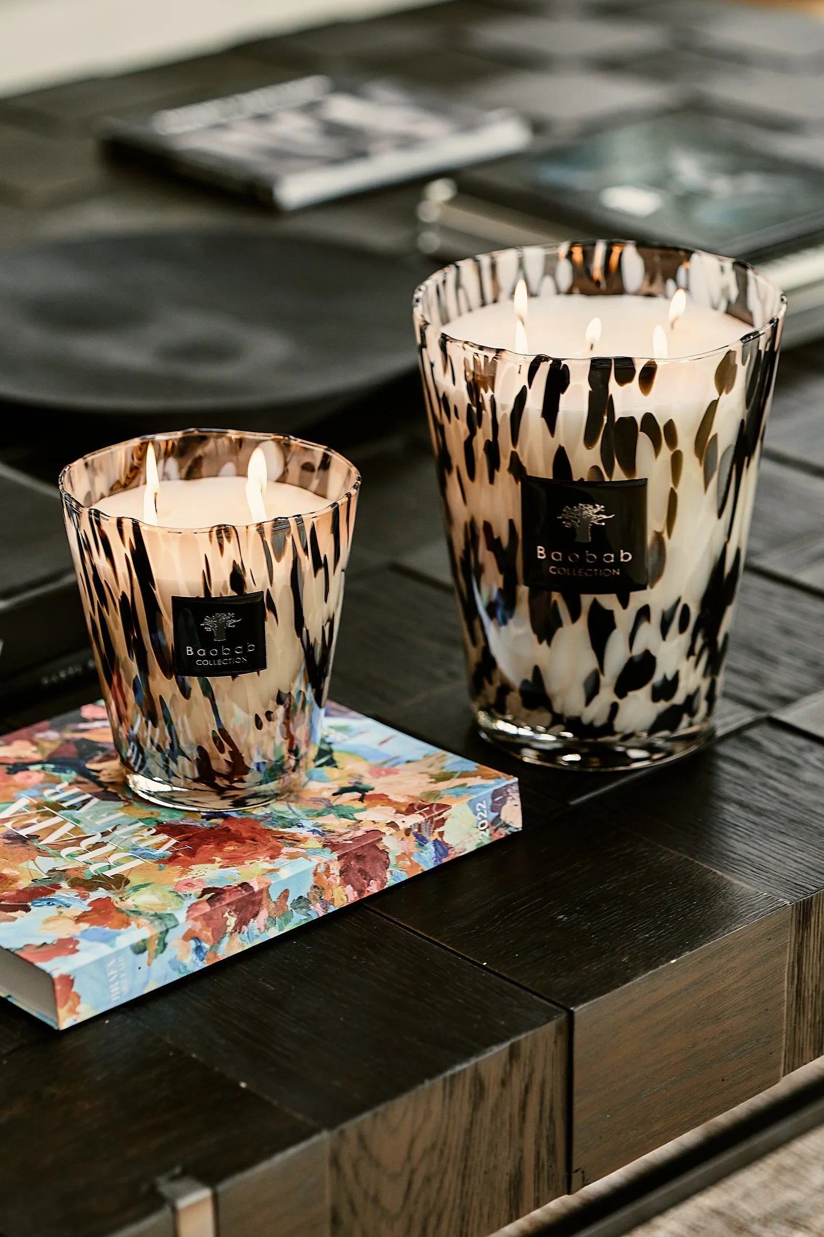Baobab Collection scented candles in stylish hand-blown glass on a coffee table, showcasing elegance and luxury.