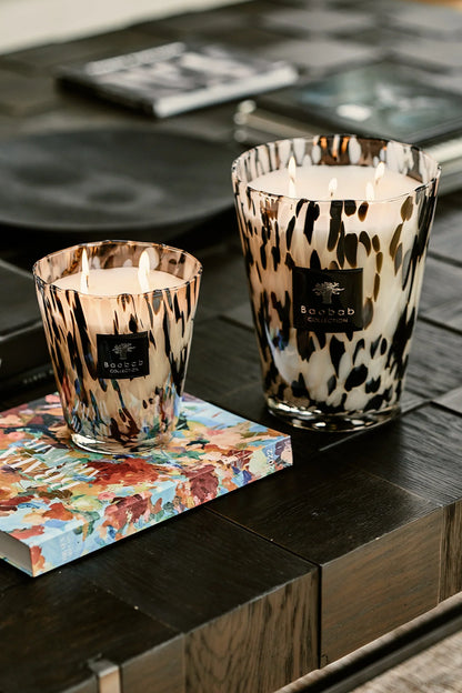 Baobab Collection scented candles in stylish hand-blown glass on a coffee table, showcasing elegance and luxury.