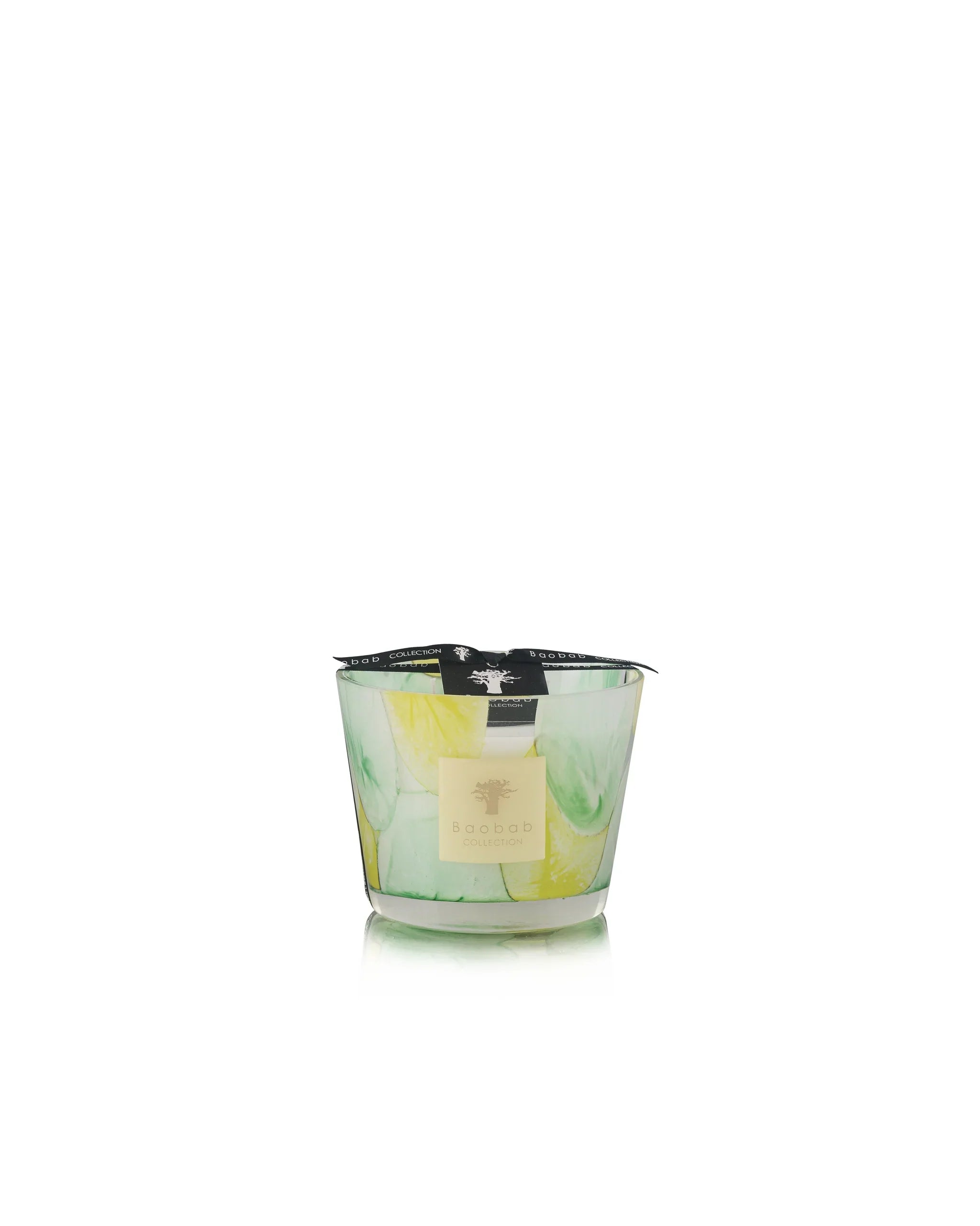 Hand-blown Baobab Collection scented candle in green and yellow hues, inspired by organic shapes.