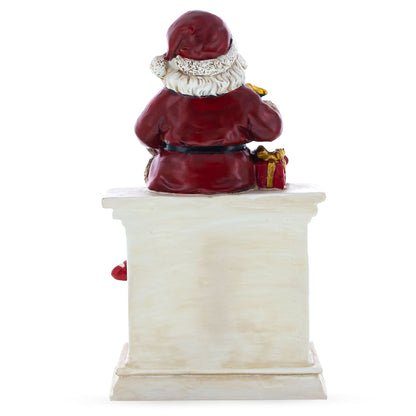 Santa Sitting on a Fireplace LED Lights Figurine 7.75 Inches