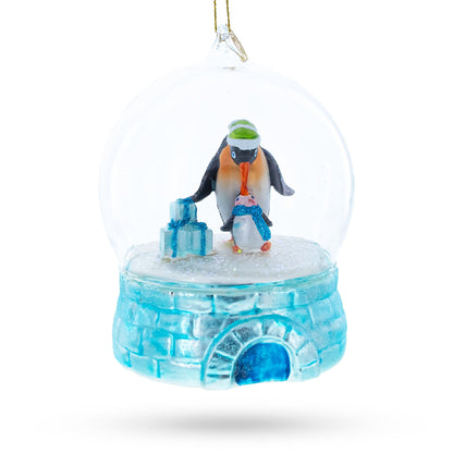 Penguins in the Igloo Dome Glass Christmas Ornament