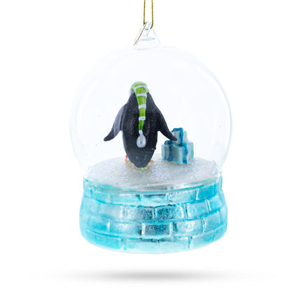 Penguins in the Igloo Dome Glass Christmas Ornament