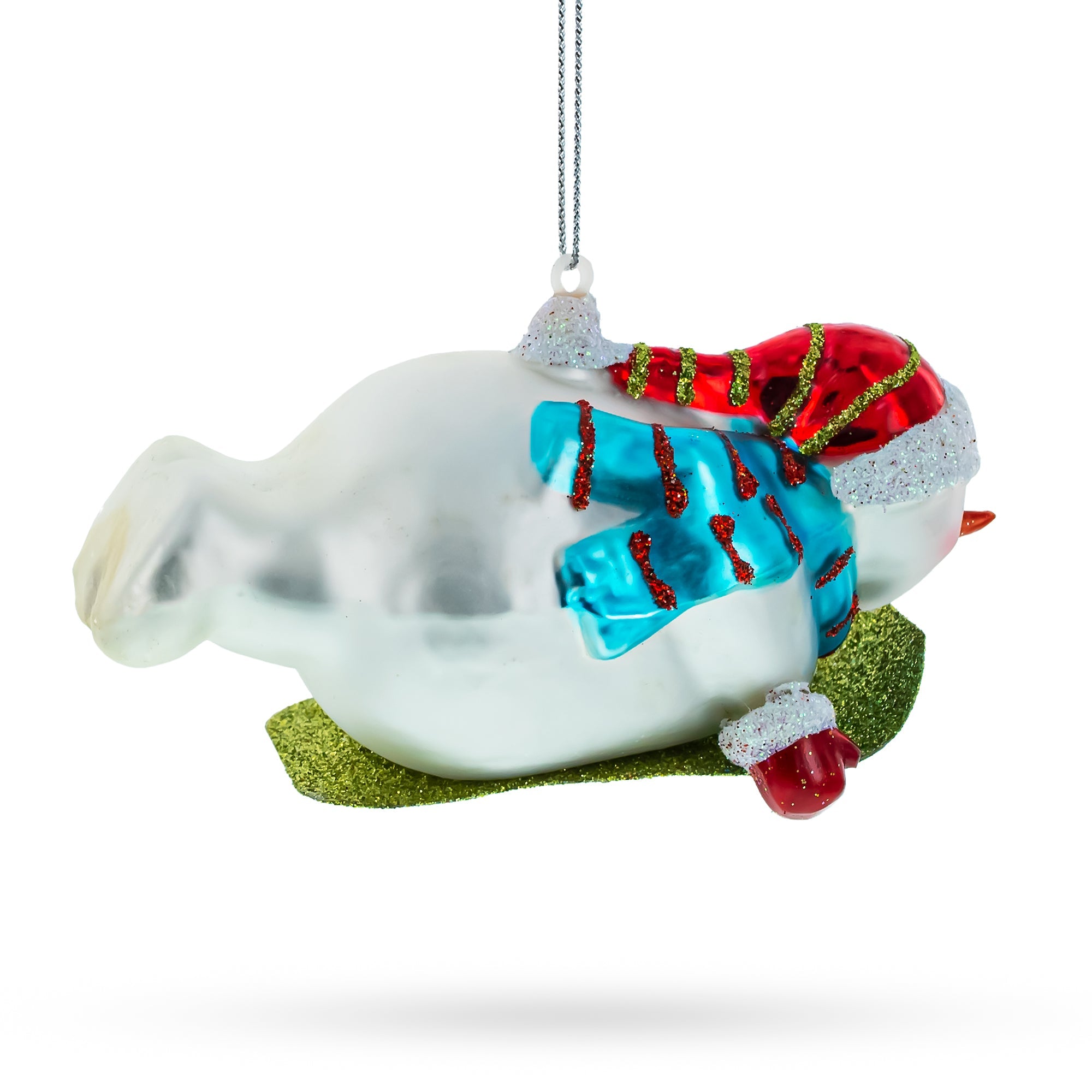 Snowman Gleefully Riding a Sled Glass Christmas Ornament