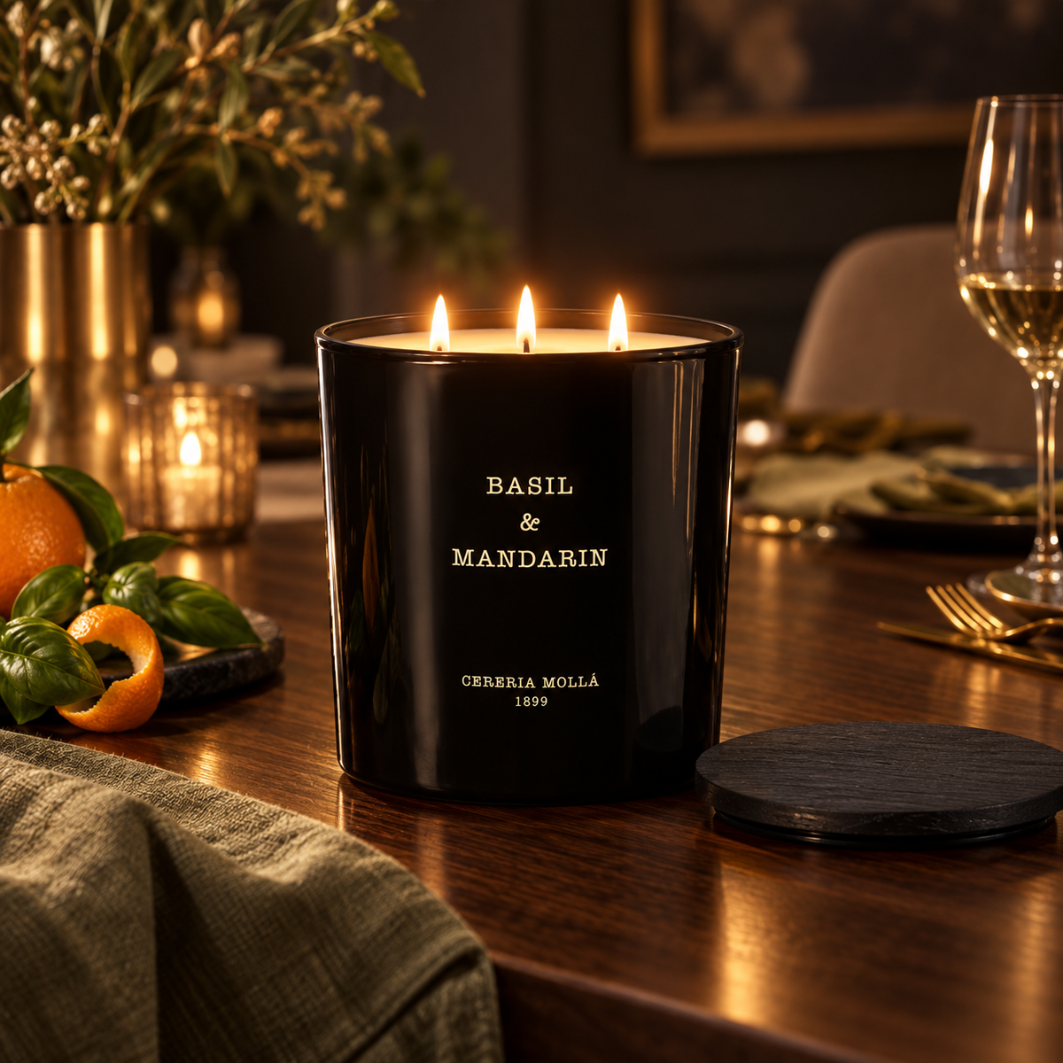 Cereria Molla Basil & Mandarin 3-wick XL candle in an elegant dining room