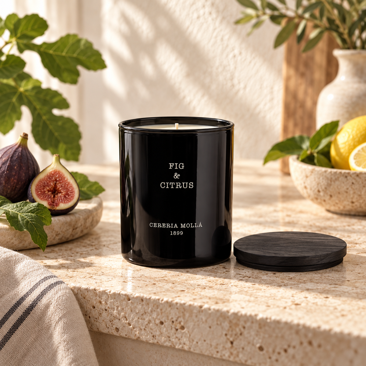 Cereria Molla Fig & Citrus 230 g candle in a sunlit Mediterranean kitchen