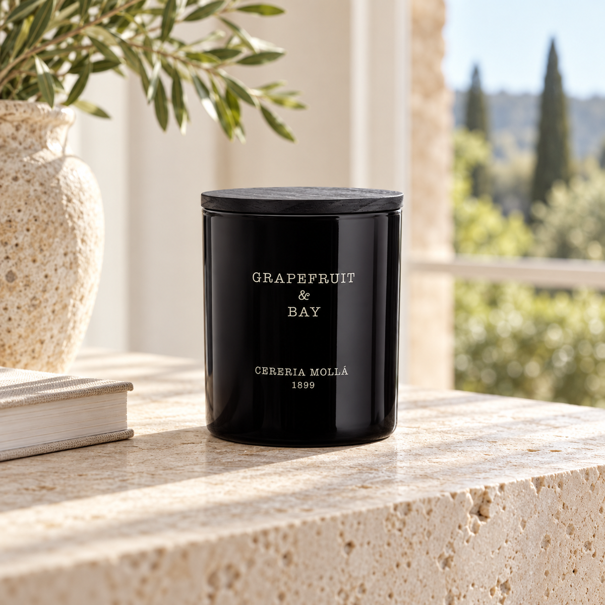 Cereria Molla Grapefruit & Bay 230 g candle in a sunlit Mediterranean interior