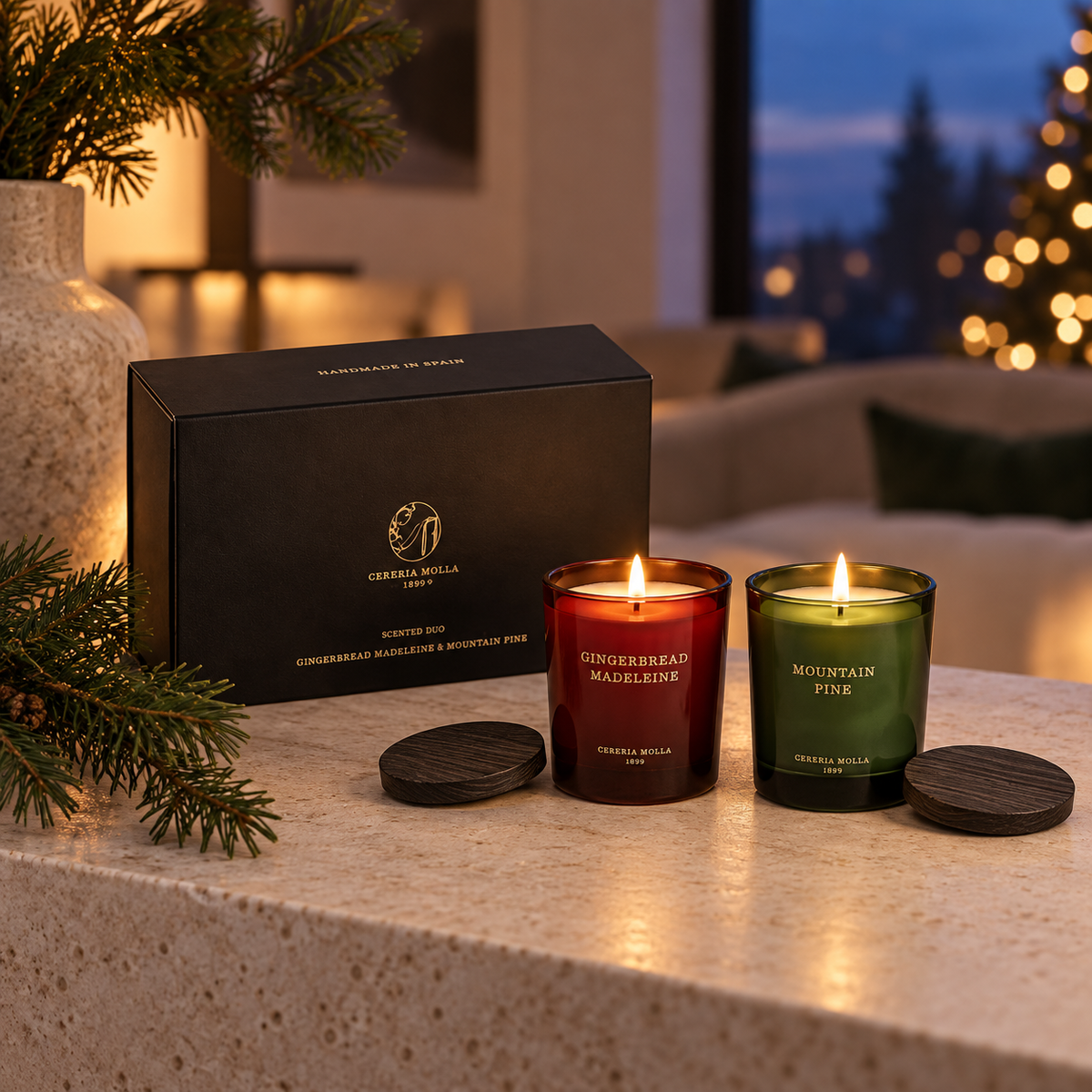 Cereria Molla Holiday Gift Set with two lit candles in a luxury evening interior