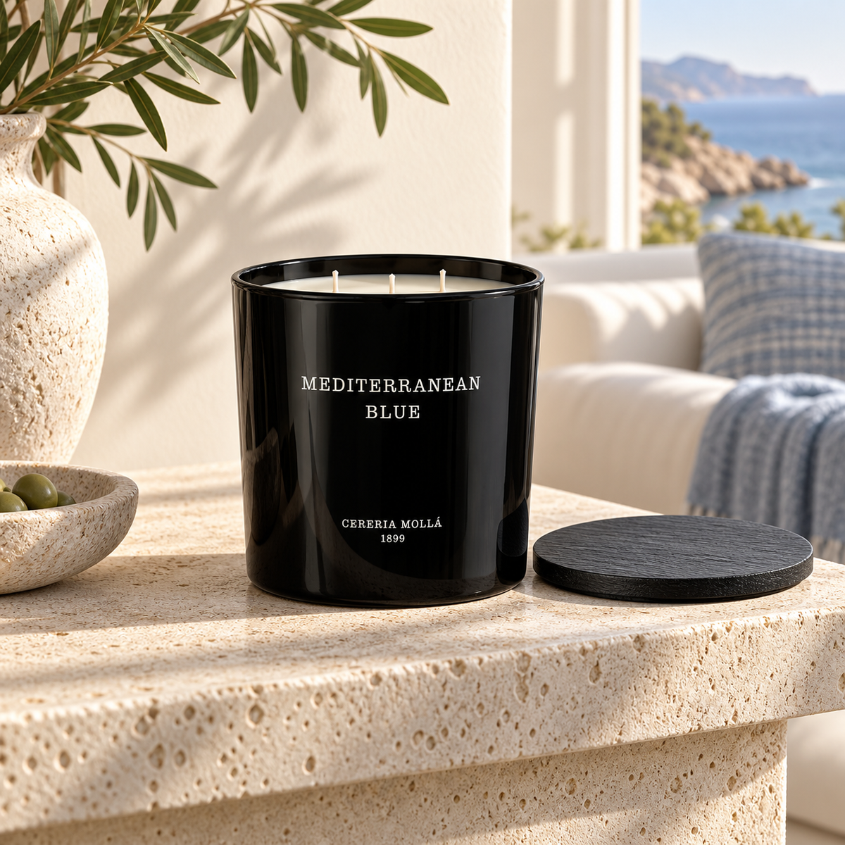 Cereria Molla Mediterranean Blue Black 600 g XL candle in a sunlit coastal living room