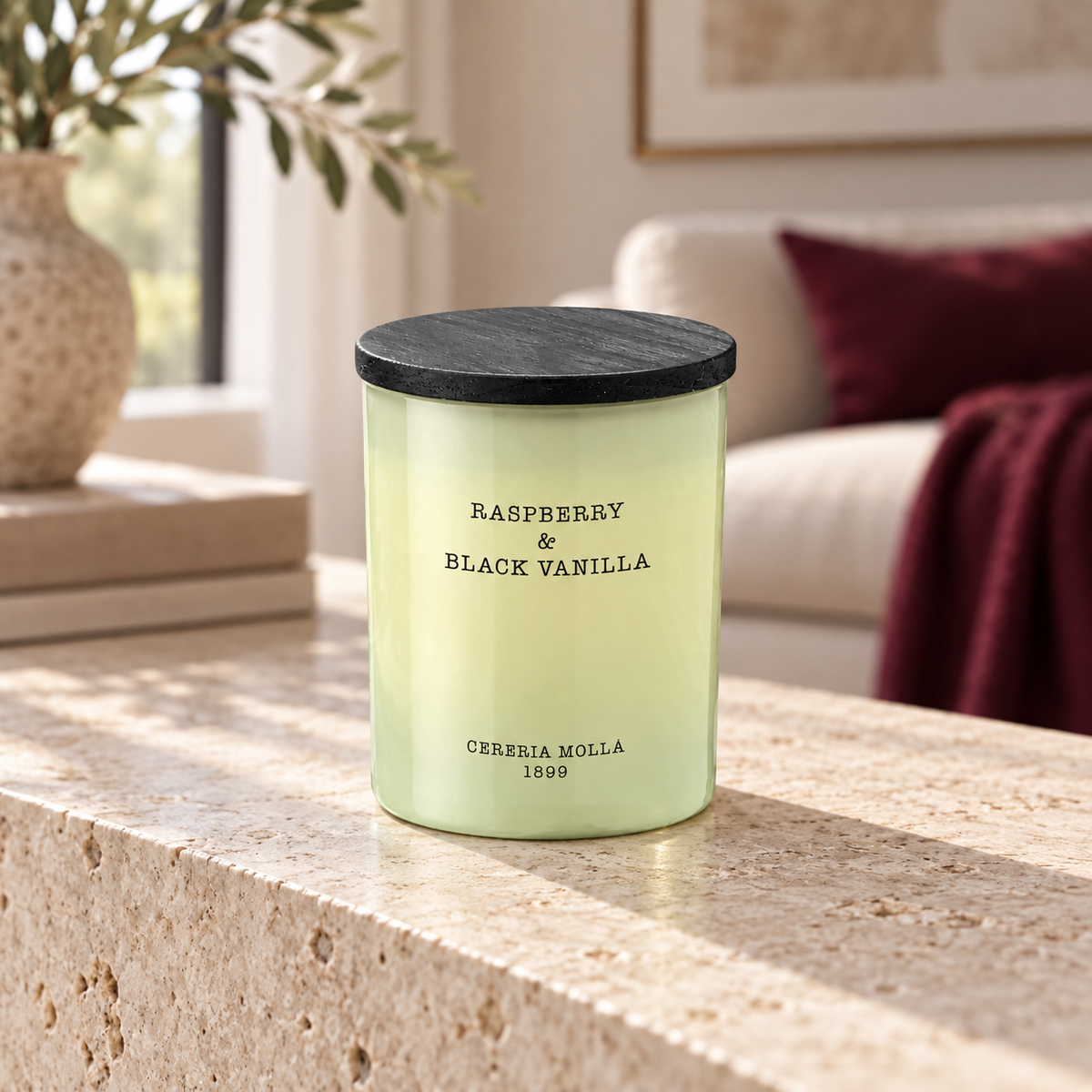 Cereria Molla Raspberry & Black Vanilla 230 g candle in a sunlit luxury interior