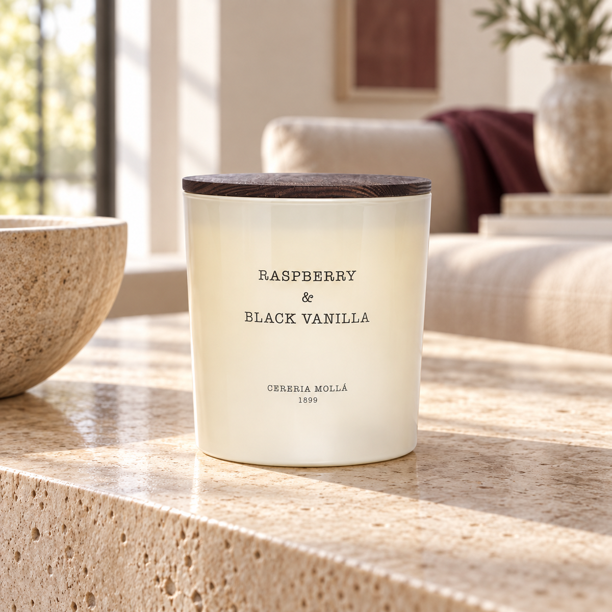 Cereria Molla Raspberry & Black Vanilla XL candle in a sunlit luxury interior
