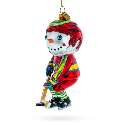 Energetic Snowman Playing Hockey Glass Christmas Ornament