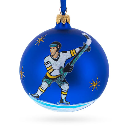 Hockey Player in Action on Blue Glass Ball Christmas Sports Ornament 4 Inches