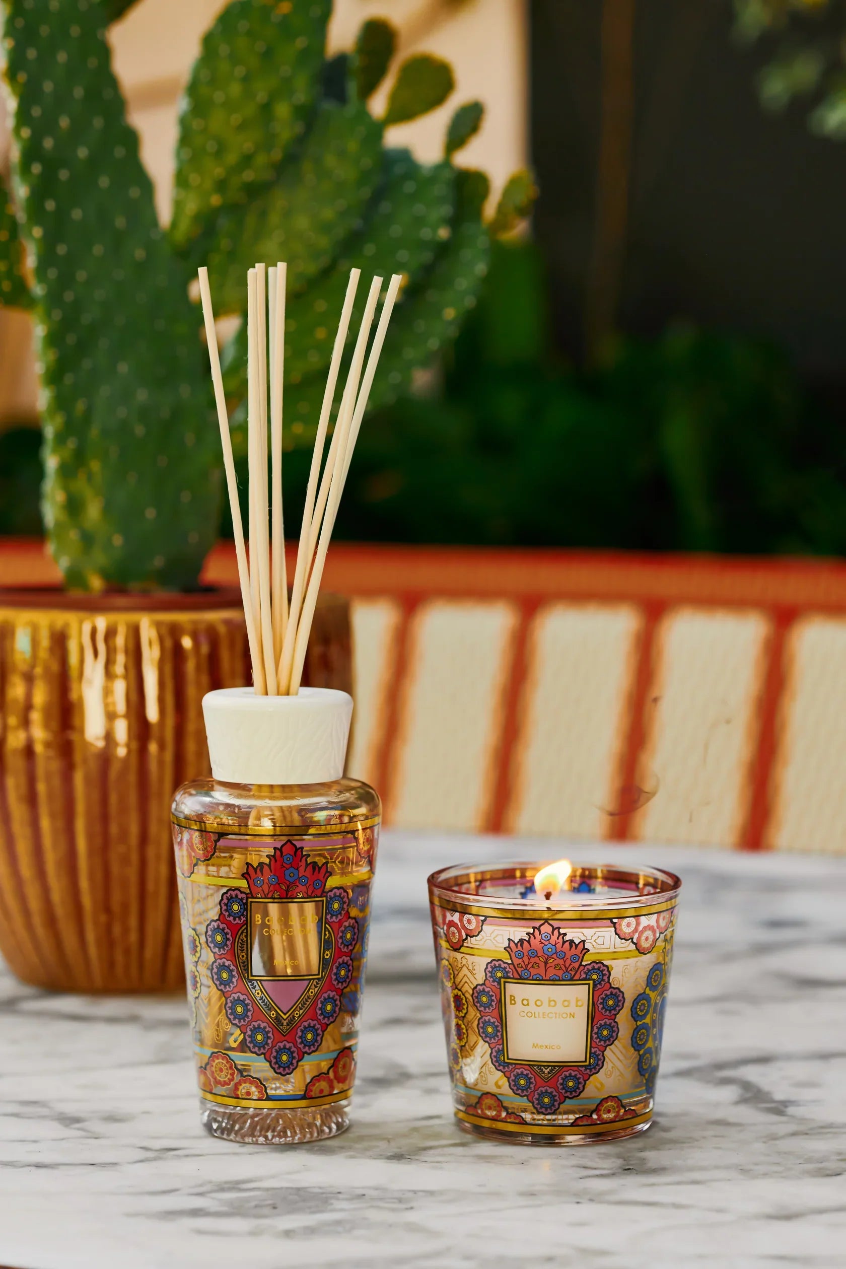 Baobab Collection gift box with candle and diffuser featuring colorful ex-voto heart design inspired by Mexican crafts.